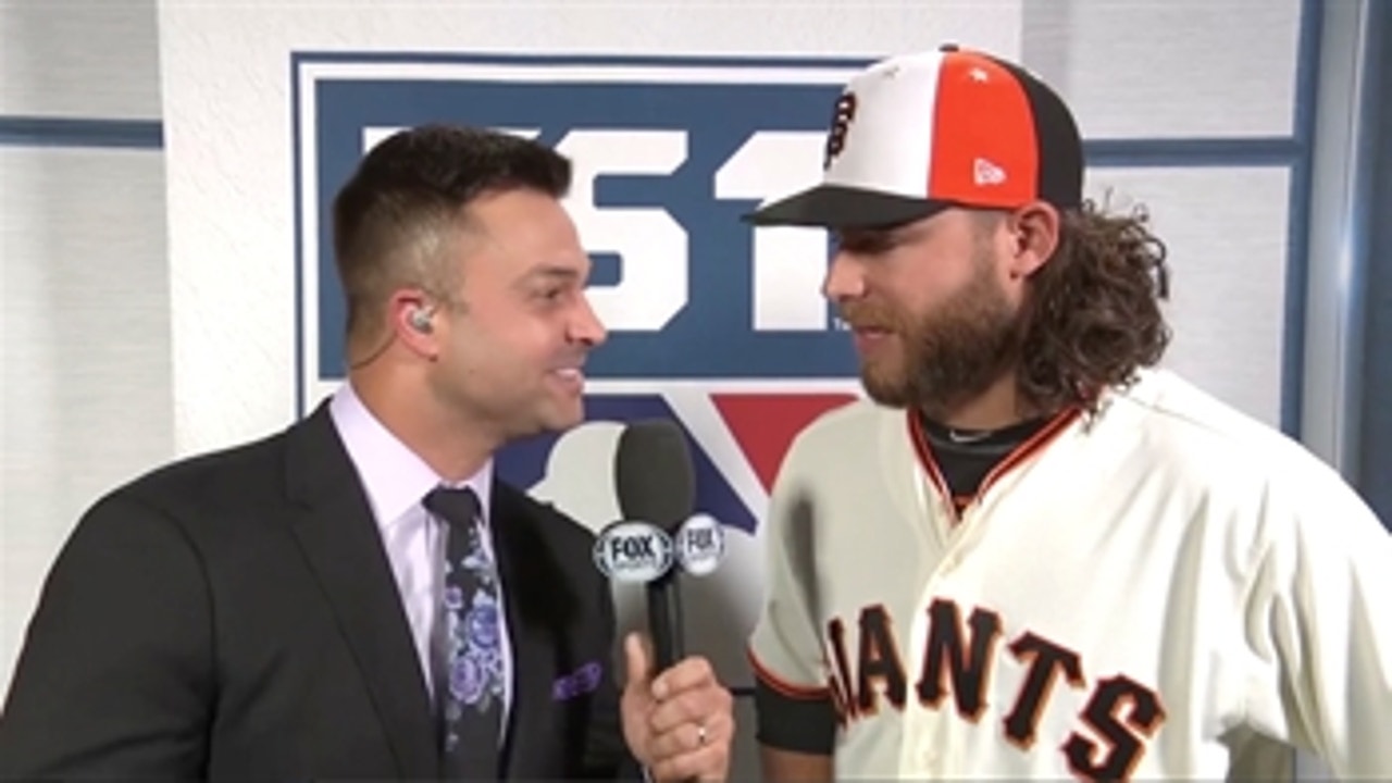 National League starting shortstop Brandon Crawford talks with Nick Swisher
