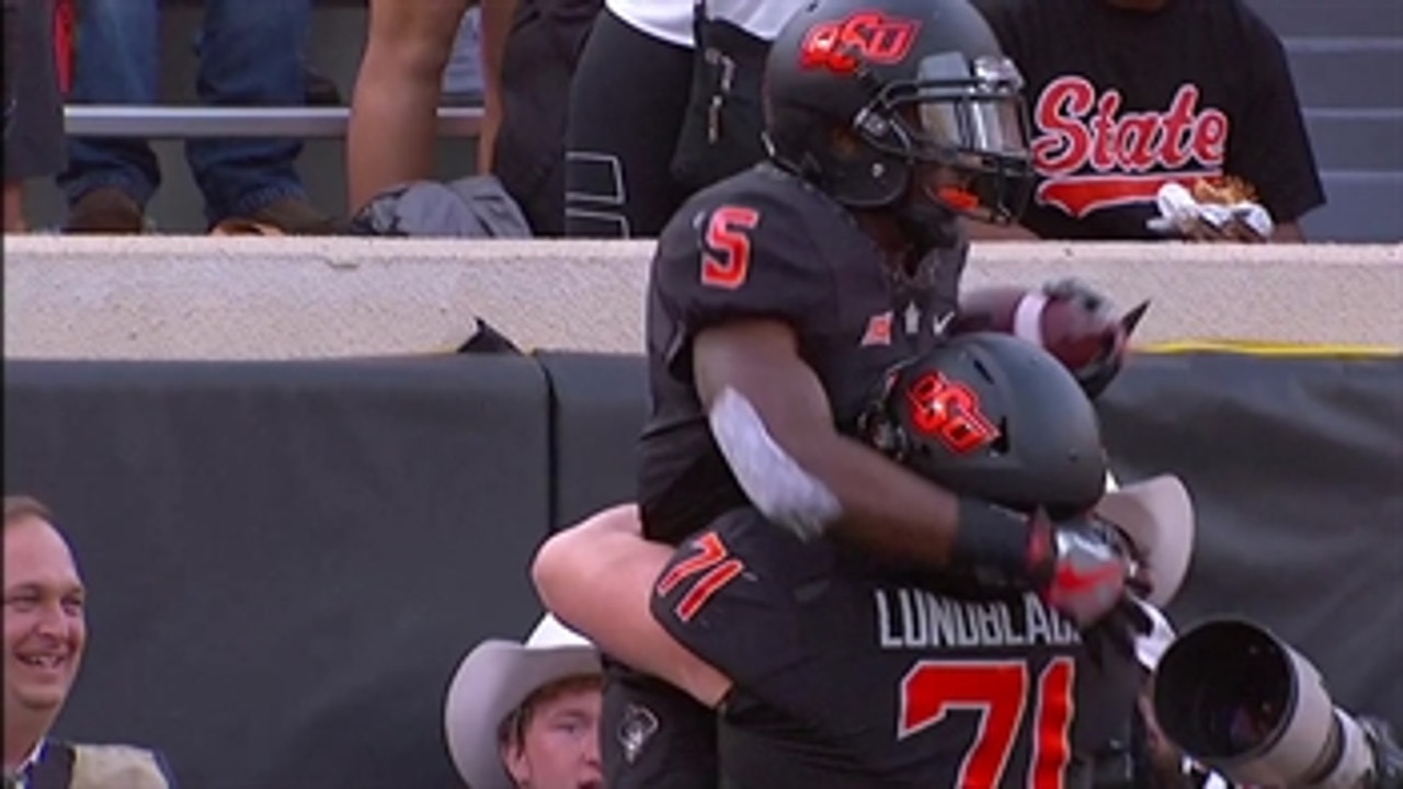 It's Bedlam in Stillwater as Justice Hill runs it in from 30 yards out to tie it up at 38-38