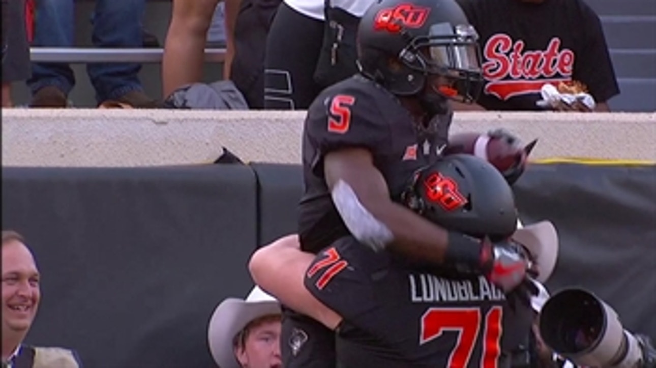 It's Bedlam in Stillwater as Justice Hill runs it in from 30 yards out to tie it up at 38-38