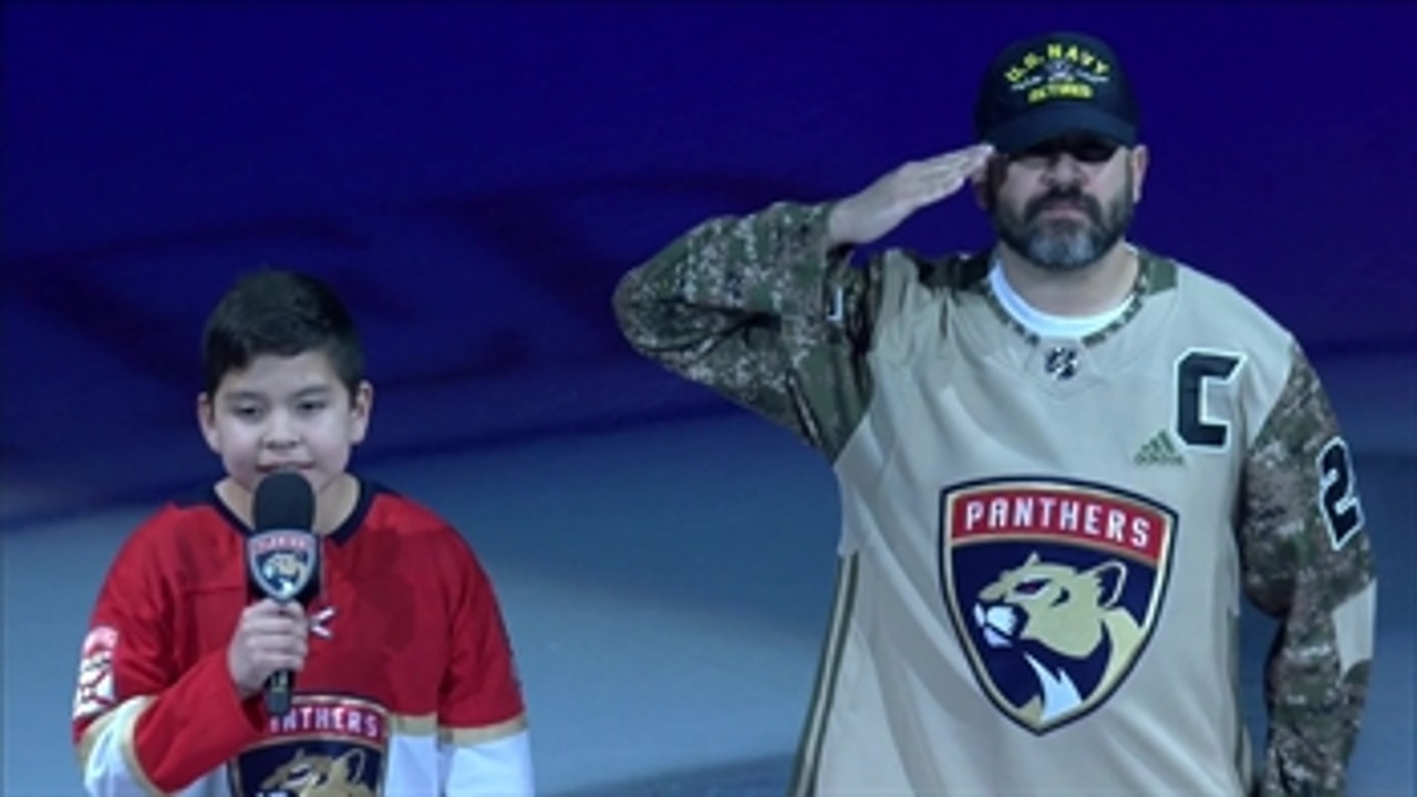 Officer Nestor Palma and Martin Flores perform National Anthem at Wild-Panthers matchup