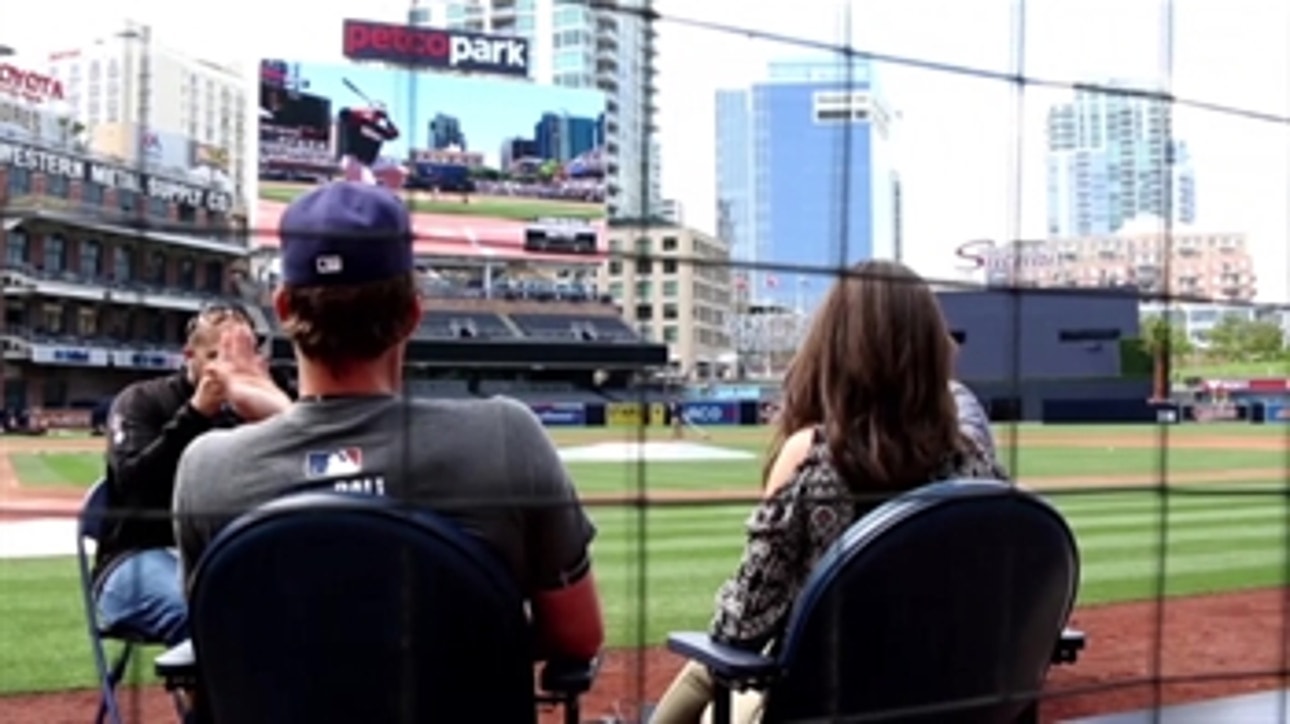 Wil Myers and Michelle Margaux play MLB The Show on the Petco Park's  videoboard