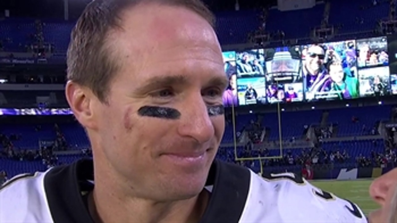 Drew Brees talks to Laura Okmin after throwing his 500th touchdown