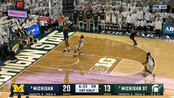 Michigan's Aday Mara blocks and throws full court pass to Morez Johnson Jr. for dunk, extending lead vs. Michigan State