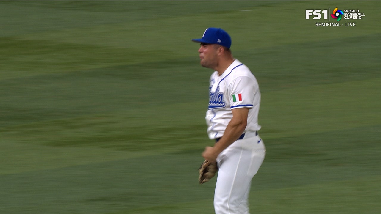 Italy's Jacob Marsee catches and throws out Maikel Garcia at first to complete double play against Venezuela
