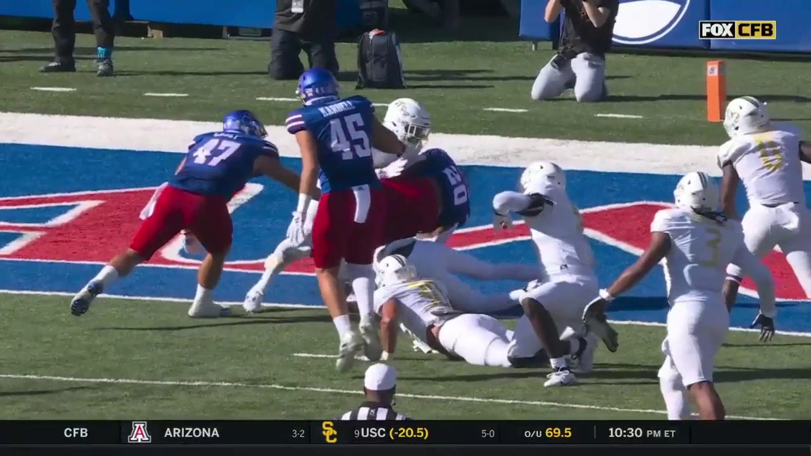 Daniel Hishaw Jr. rushes for a three-yard TD to extend Kansas' lead