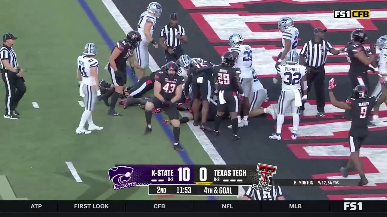 Behren Morton smashes ahead for a one-yard touchdown rush to help Texas Tech get on the scoreboard against Kansas State