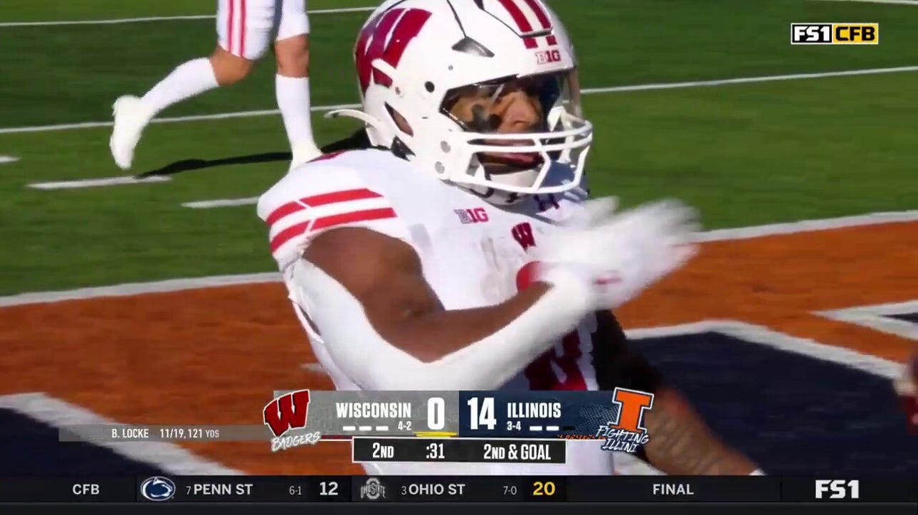 Wisconsin's Braelon Allen rushes for a four-yard touchdown to cut Illinois' lead