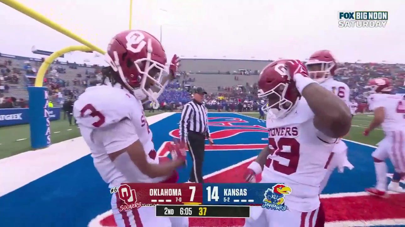 Oklahoma's Tawee Walker rushes for a three-yard TD to tie the game vs. Kansas