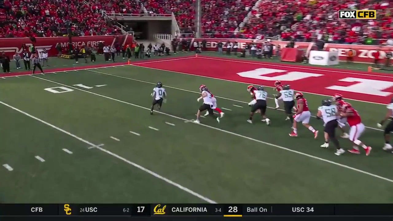 Bucky Irving cruises to the end zone on a nine-yard rushing TD to give Oregon a 28-6 lead over Utah