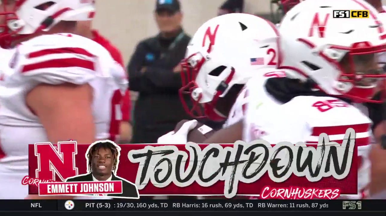 Nebraska's Emmett Johnson rushes for a four-yard TD to cut into Michigan State's lead