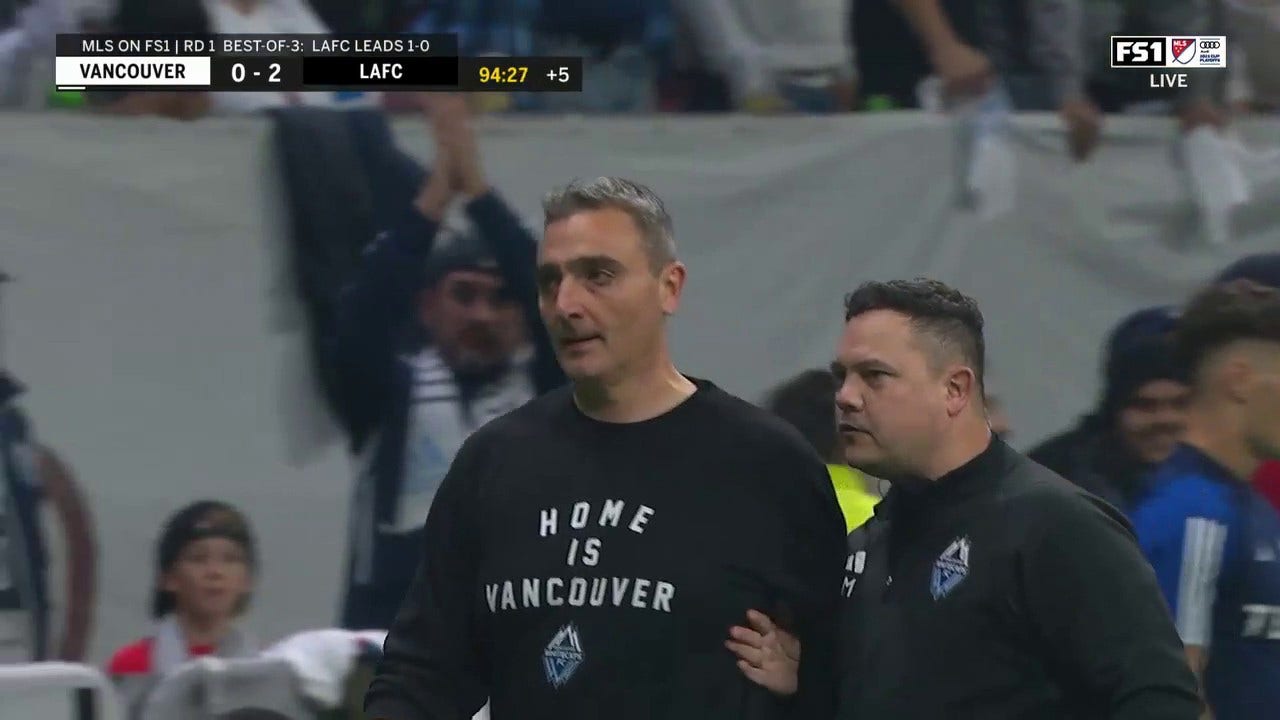  Manager Vanni Sartini receives a red card after a Vancouver player collides with ref