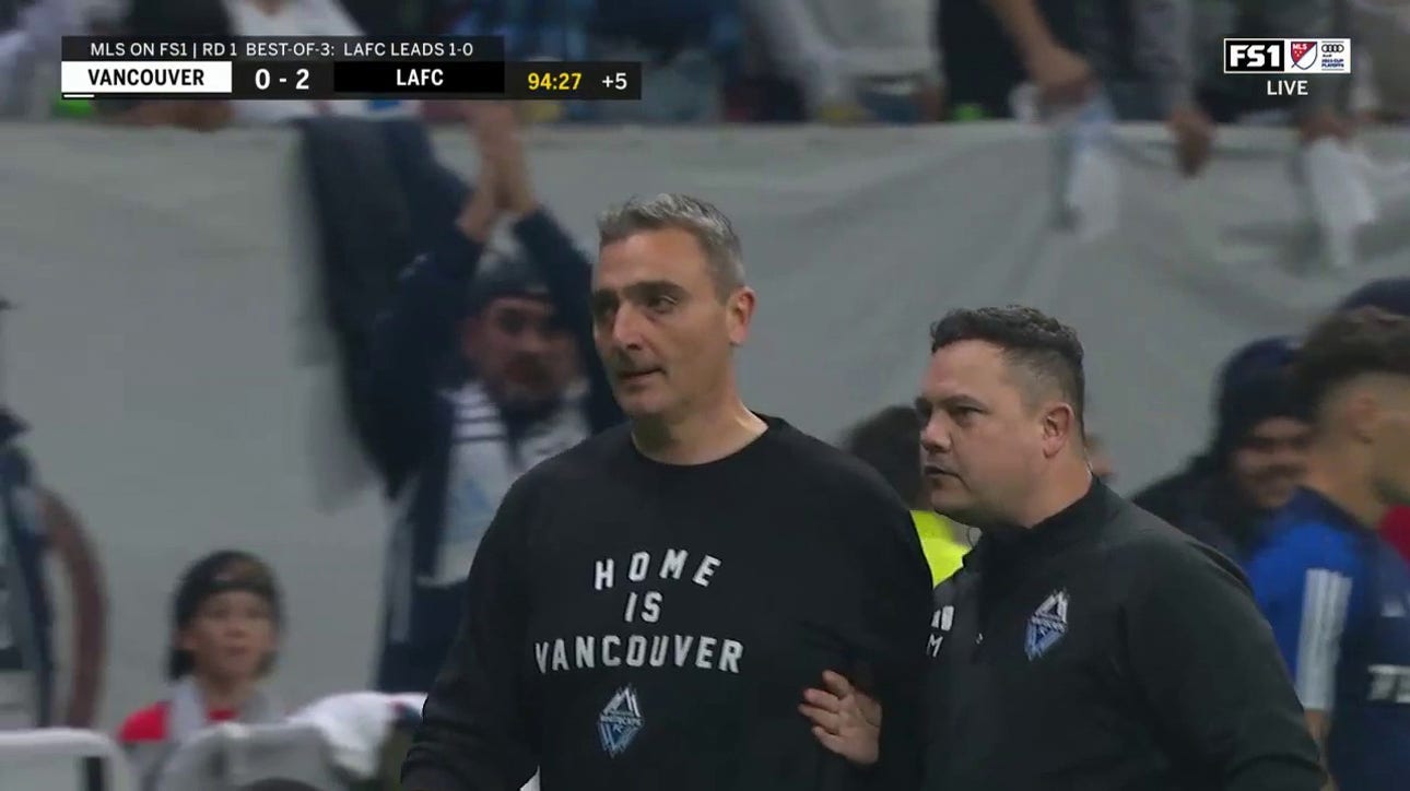  Manager Vanni Sartini receives a red card after a Vancouver player collides with ref
