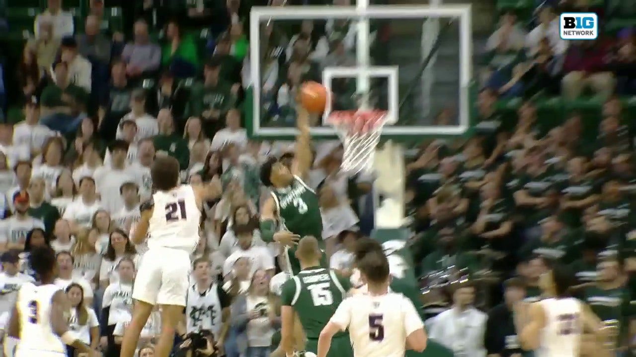 Jaden Akins throws down a one-handed slam, extending Michigan State's lead vs. Southern Indiana