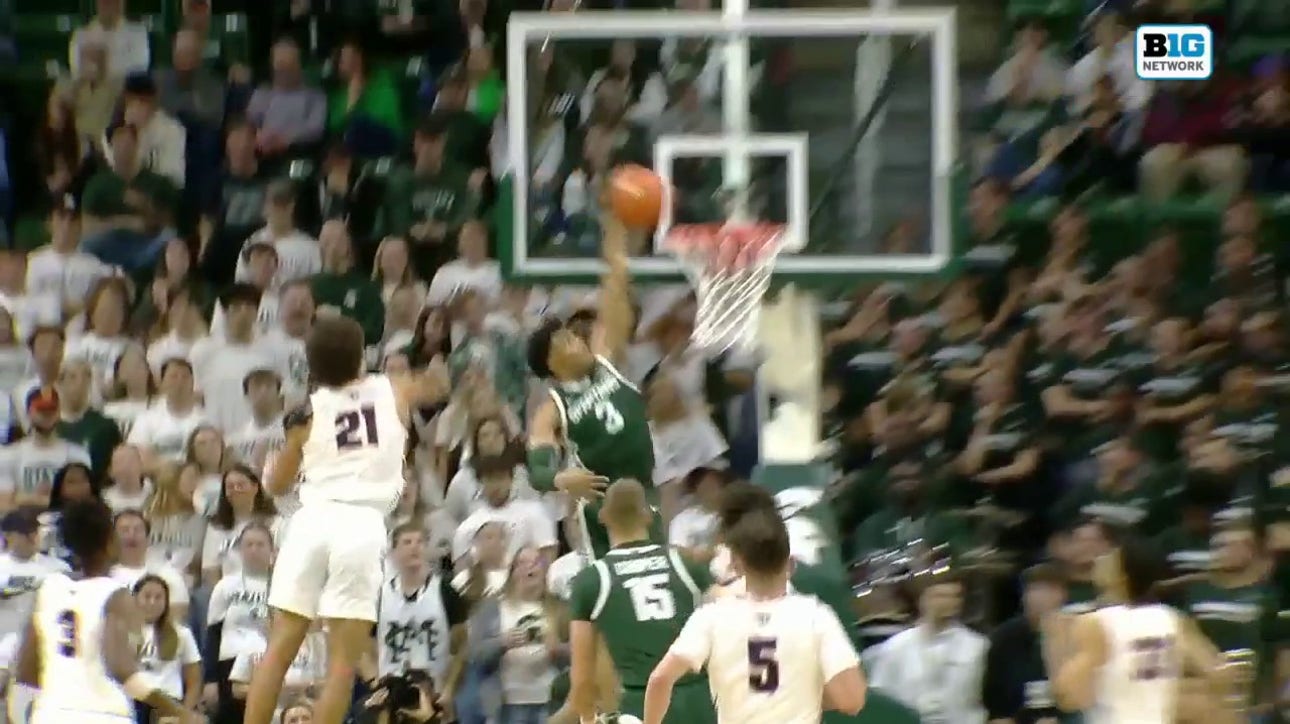 Jaden Akins throws down a one-handed slam, extending Michigan State's lead vs. Southern Indiana