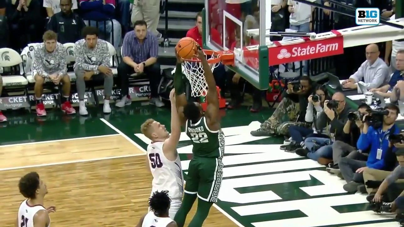 Jaden Akins dishes to Mady Sissoko inside for a two-handed flush, extending Michigan State's lead over Southern Indiana