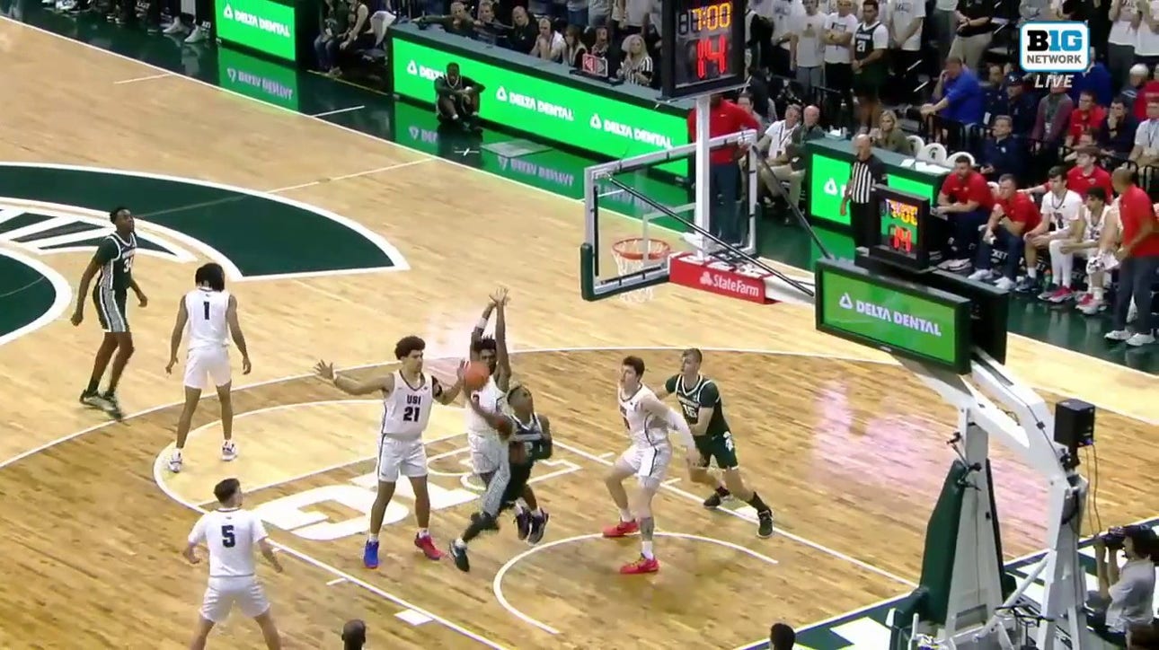 Tyson Walkers finishes through contact and gets the foul to extend Michigan State's lead over Southern Indiana