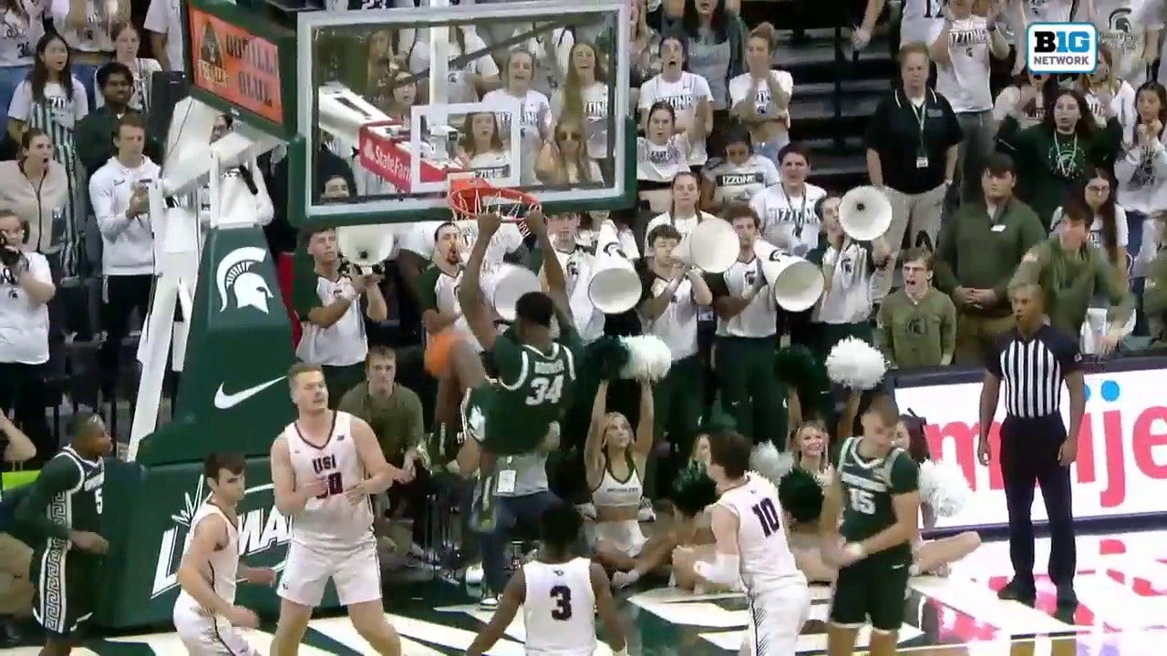 Michigan State's Xavier Booker throws down a monstrous two-handed jam against Southern Indiana