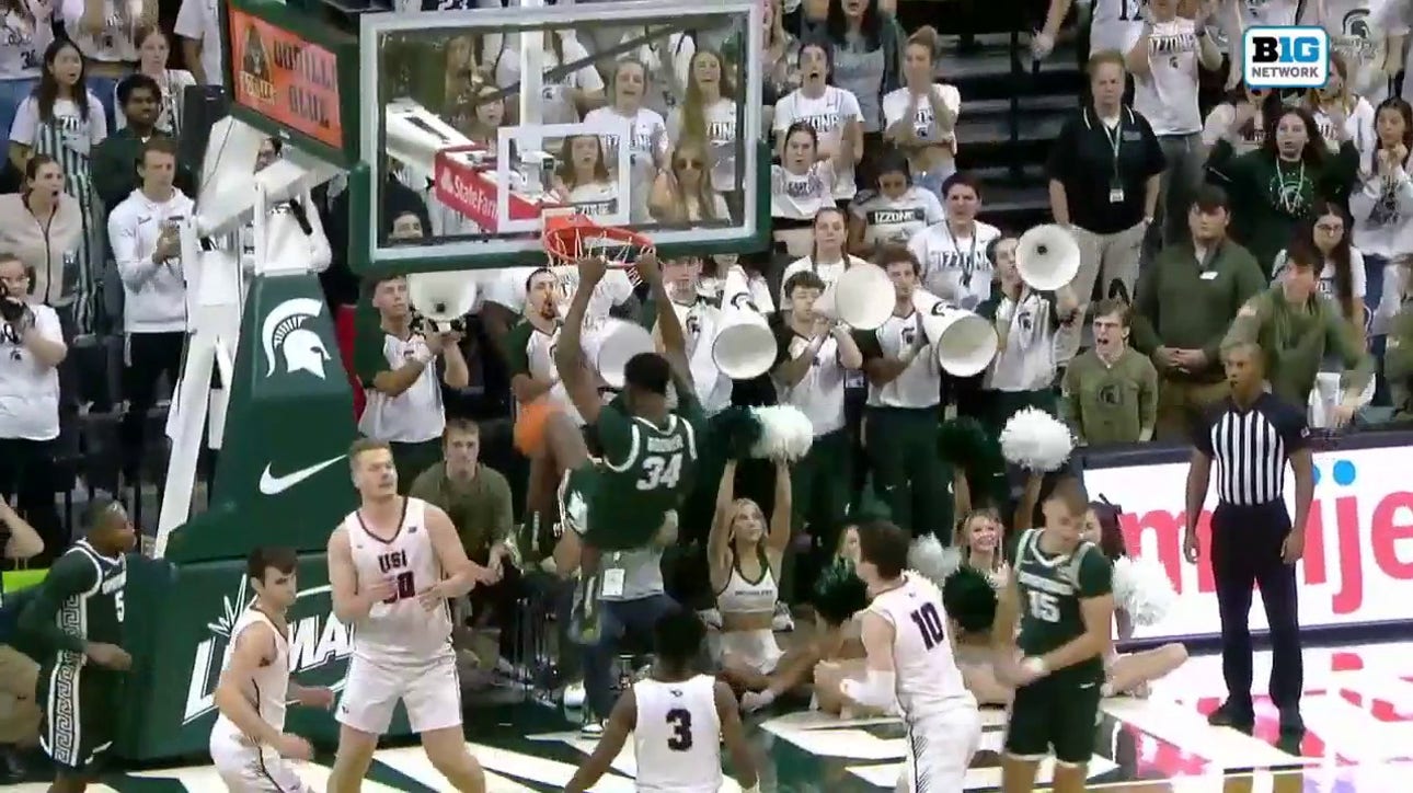 Michigan State's Xavier Booker throws down a monstrous two-handed jam against Southern Indiana