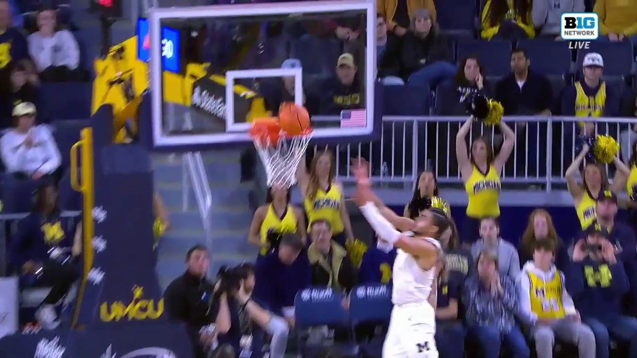 Michigan's Oliver Nkamhoua gets the block and throws down the alley-oop in transition vs. Youngstown State