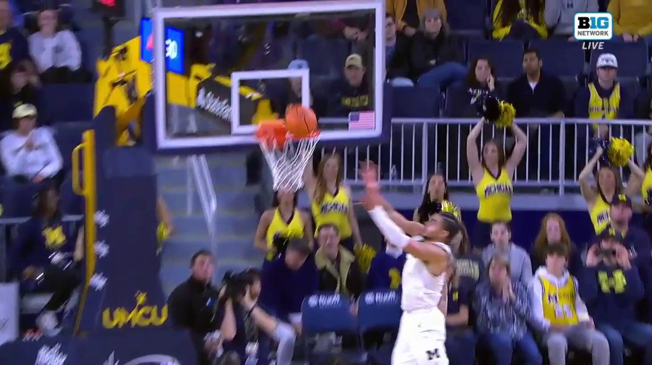 Michigan's Oliver Nkamhoua gets the block and throws down the alley-oop in transition vs. Youngstown State