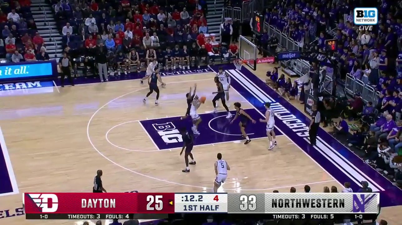 Boo Buie spins inside for the finger roll to extend Northwestern's lead over Dayton