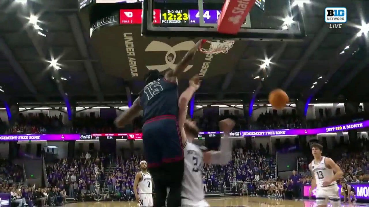 Dayton's DaRon Holmes II throws down a one-handed POSTER over Northwestern's Blake Preston