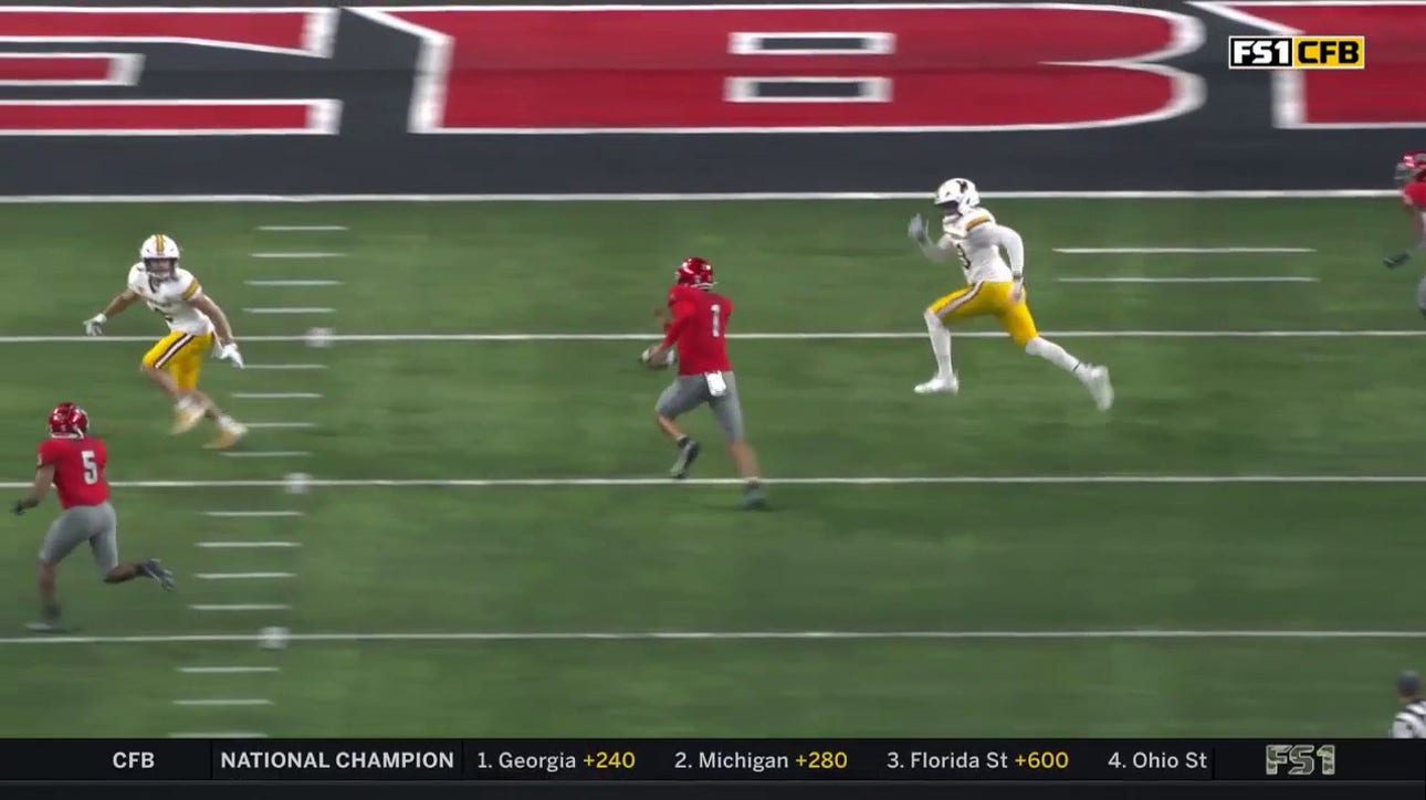 Jayden Maiava scrambles for a ten-yard touchdown to give UNLV an early lead against Wyoming