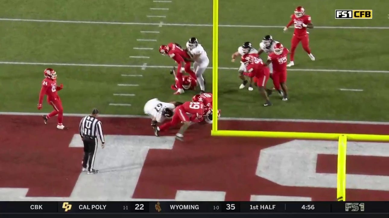 Cincinnati's Corey Kiner uses his legs to score a five-yard touchdown vs. Houston