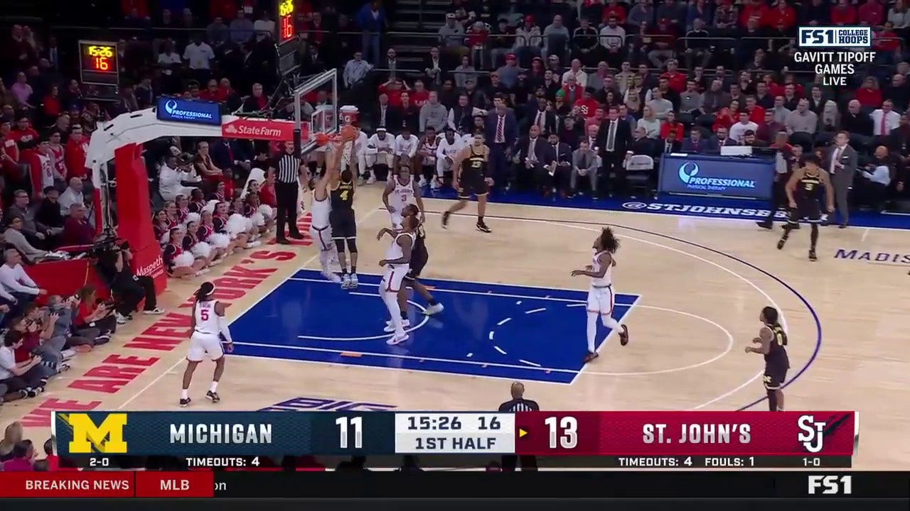 Michigan's Nimari Burnett slashes toward the rim and throws down a NASTY jam against St. John's