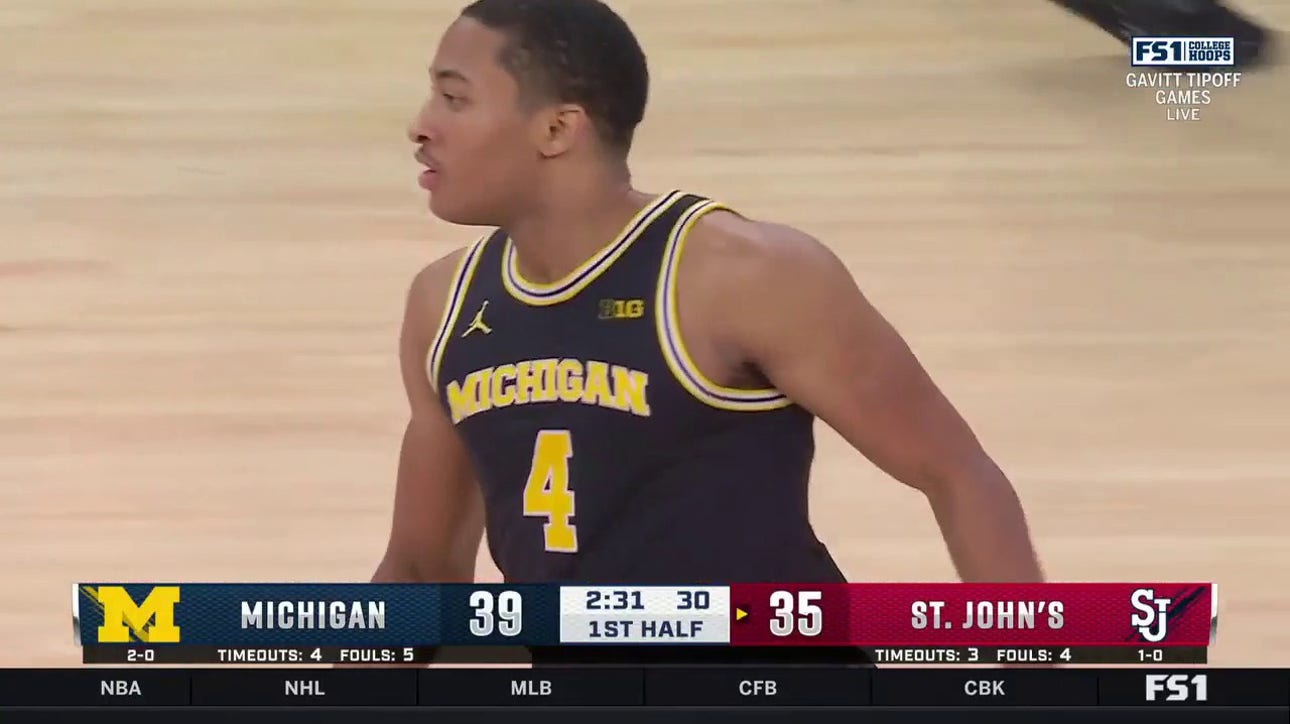 Michigan's Nimari Burnett hits a jumper and scores a career-high 21 points in the first half vs. St. John's