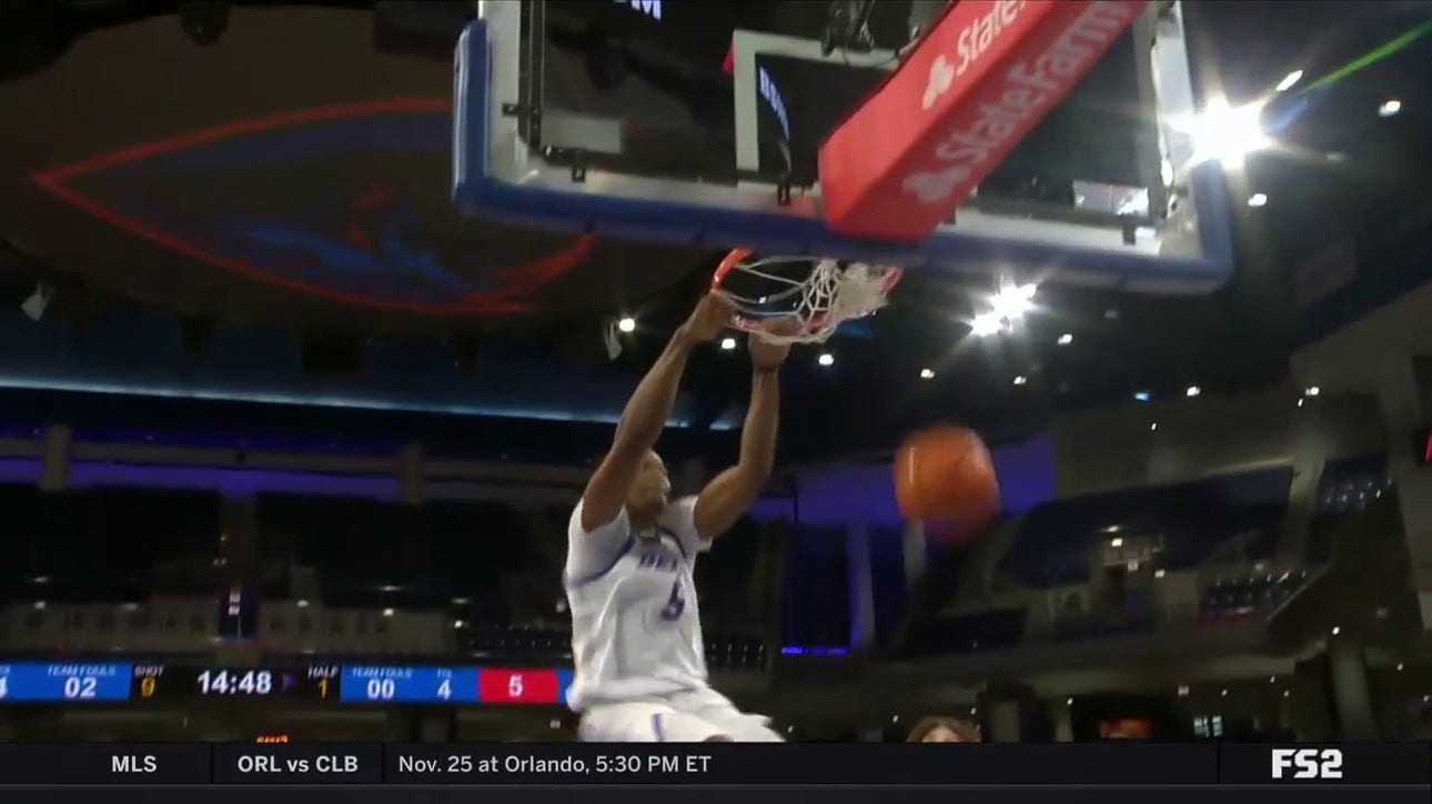 DePaul's Churchill Abass throws down a powerful two-handed dunk against South Dakota