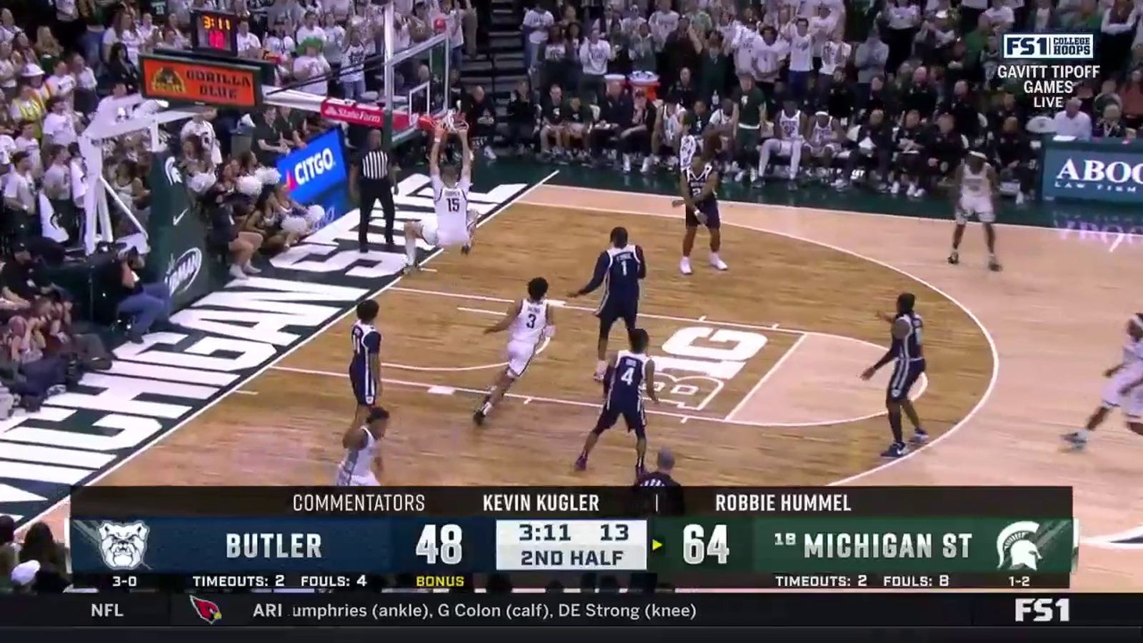 Carson Cooper finishes with the strong two-handed slam as Michigan State dominates Butler, 74-54
