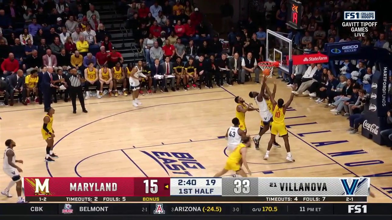 TJ Bamba snags an offensive rebound and goes up strong as Villanova maintains a large lead against Maryland