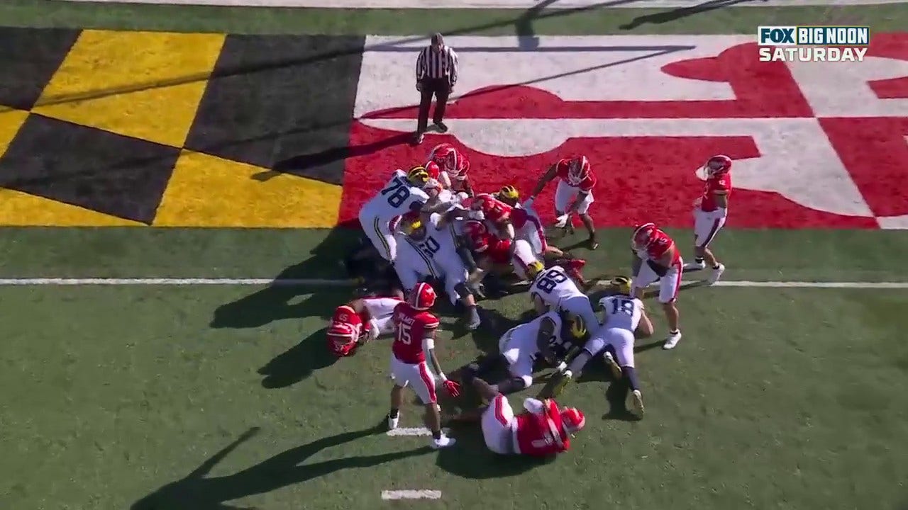 Blake Corum rushes for a two-yard touchdown to give Michigan a lead over Maryland