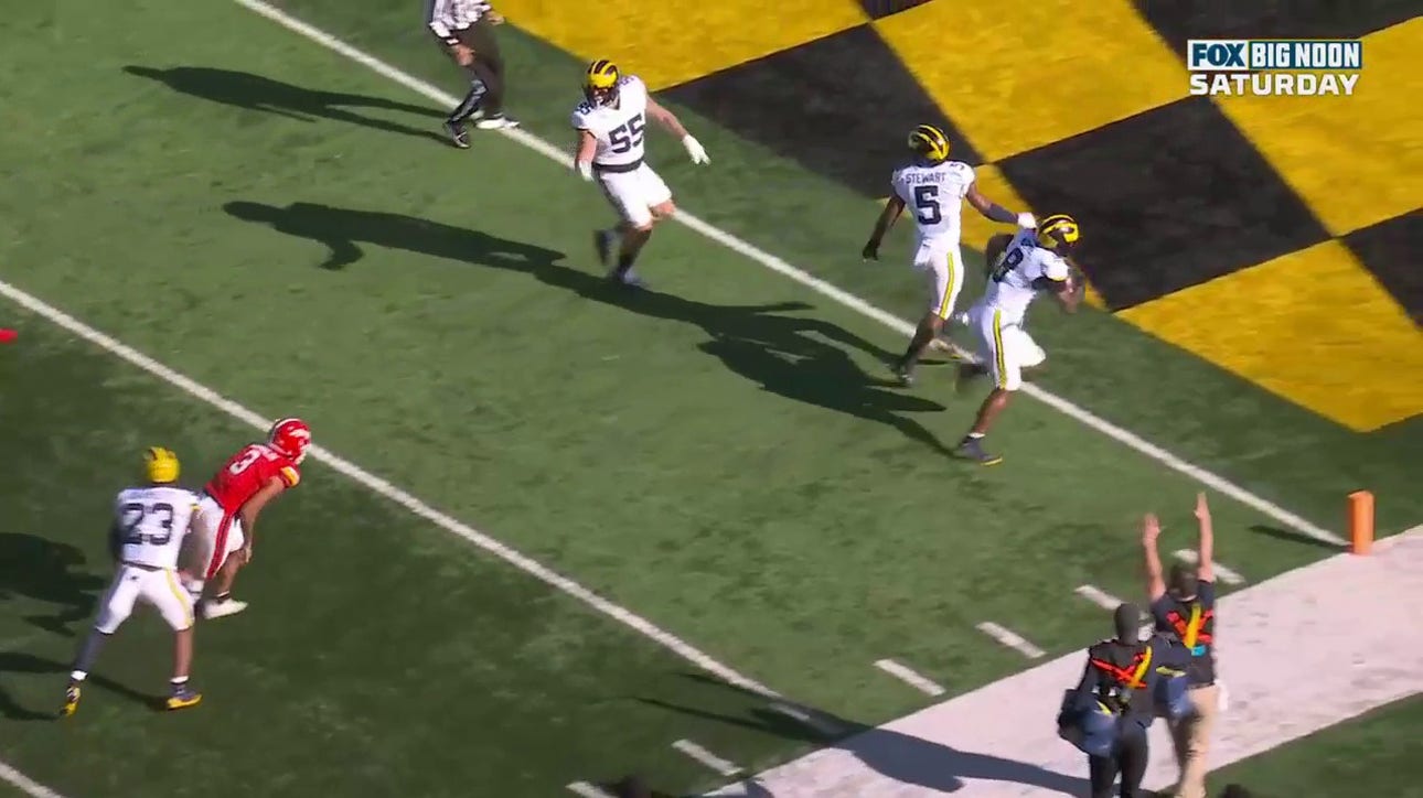 Michigan's Derrick Moore recovers a fumble and scores a touchdown against Maryland