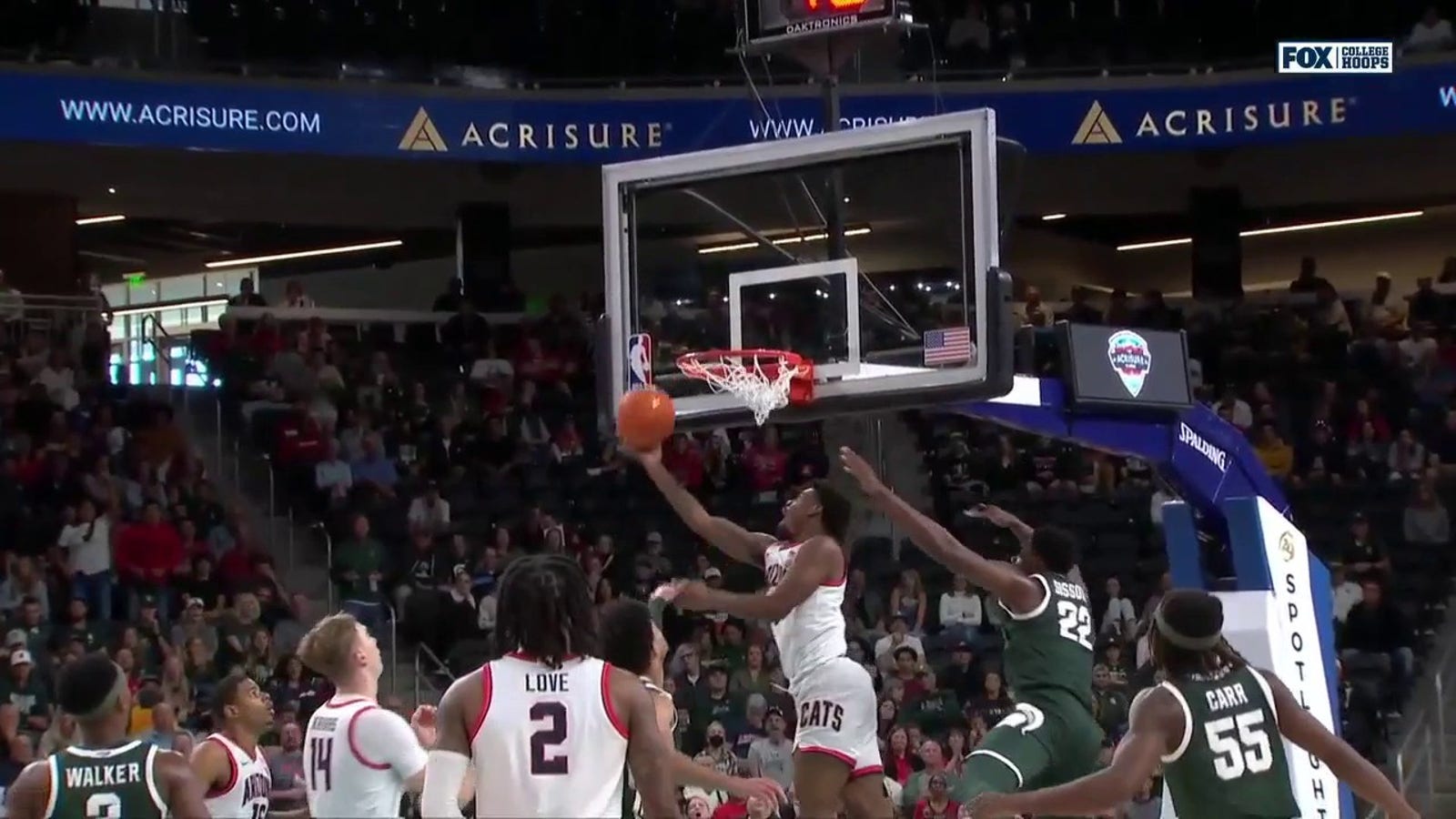 KJ Lewis makes an acrobatic finish at the rim to extend Arizona's lead over Michigan State