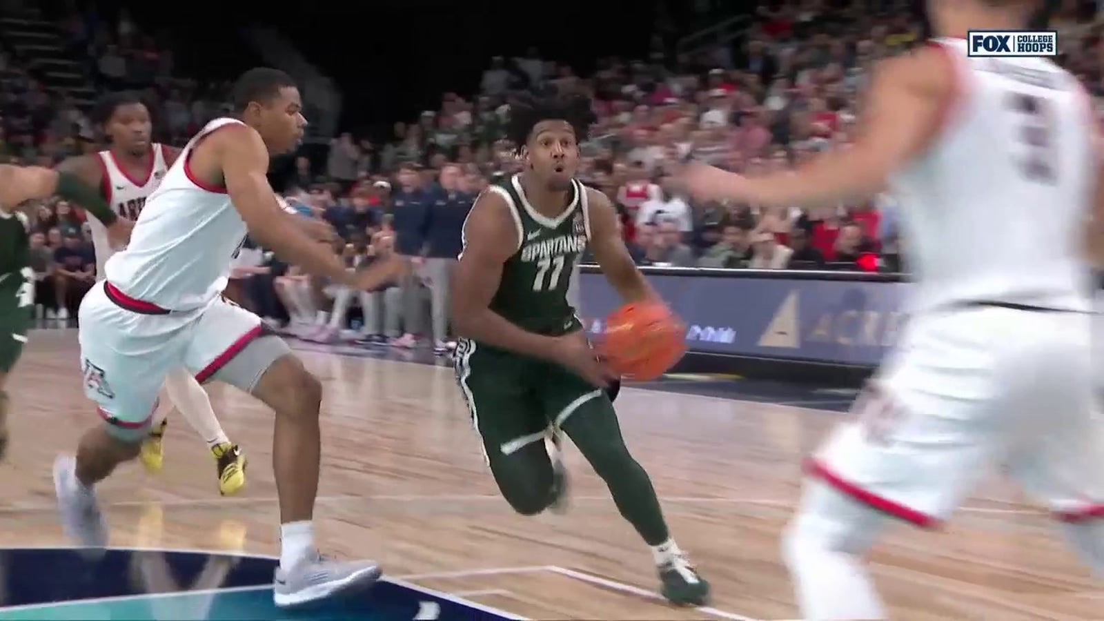 A.J. Hoggard sinks the layup to give Michigan State the lead against Arizona