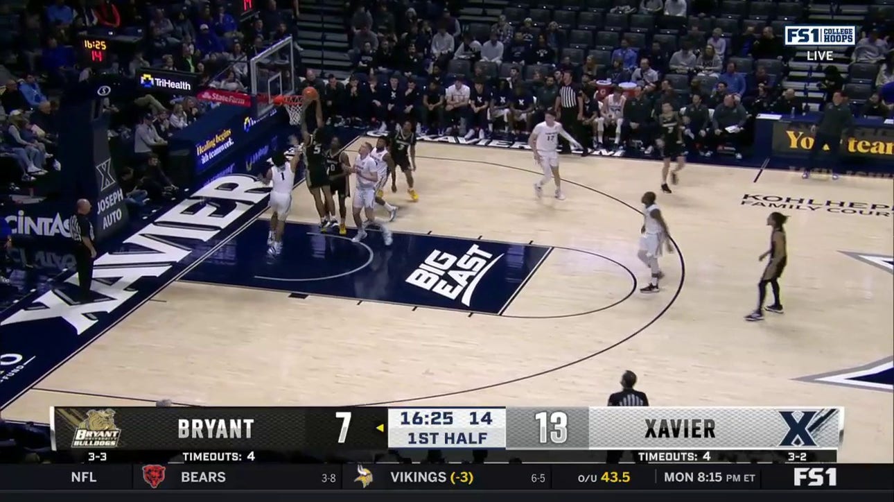 Daniel Rivera throws down a two-handed dunk to help Bryant shrink the lead against Xavier