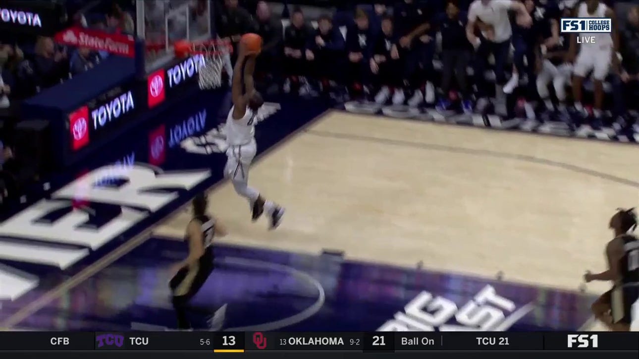 Quincy Olivari with the interception and fast break dunk to extend Xavier's lead over Bryant