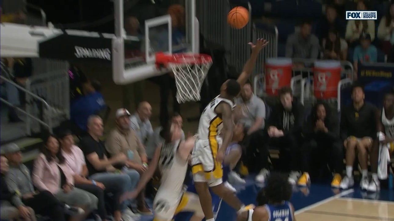 Iowa's Tony Perkins goes airborne and gets the block against Seton Hall