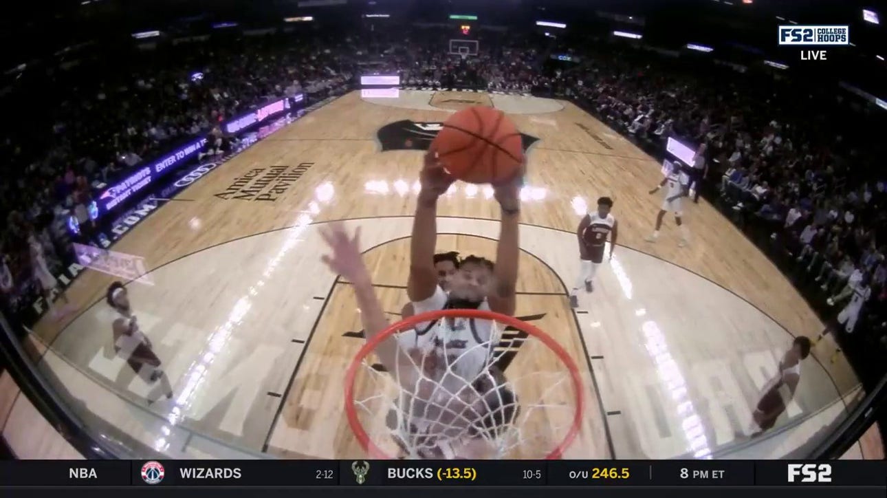 Providence's Bryce Hopkins throws down an epic two-handed dunk over a LeHigh defender