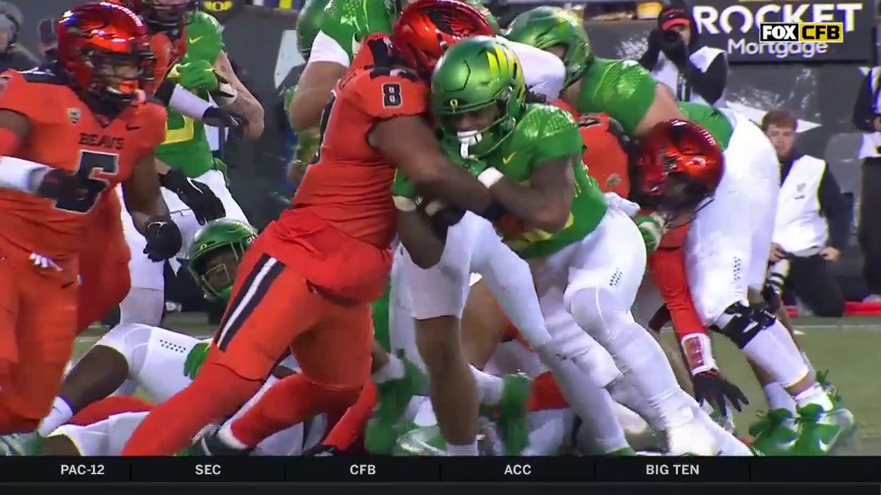 Jordan James punches in a one-yard touchdown to extend Oregon's lead over Oregon State