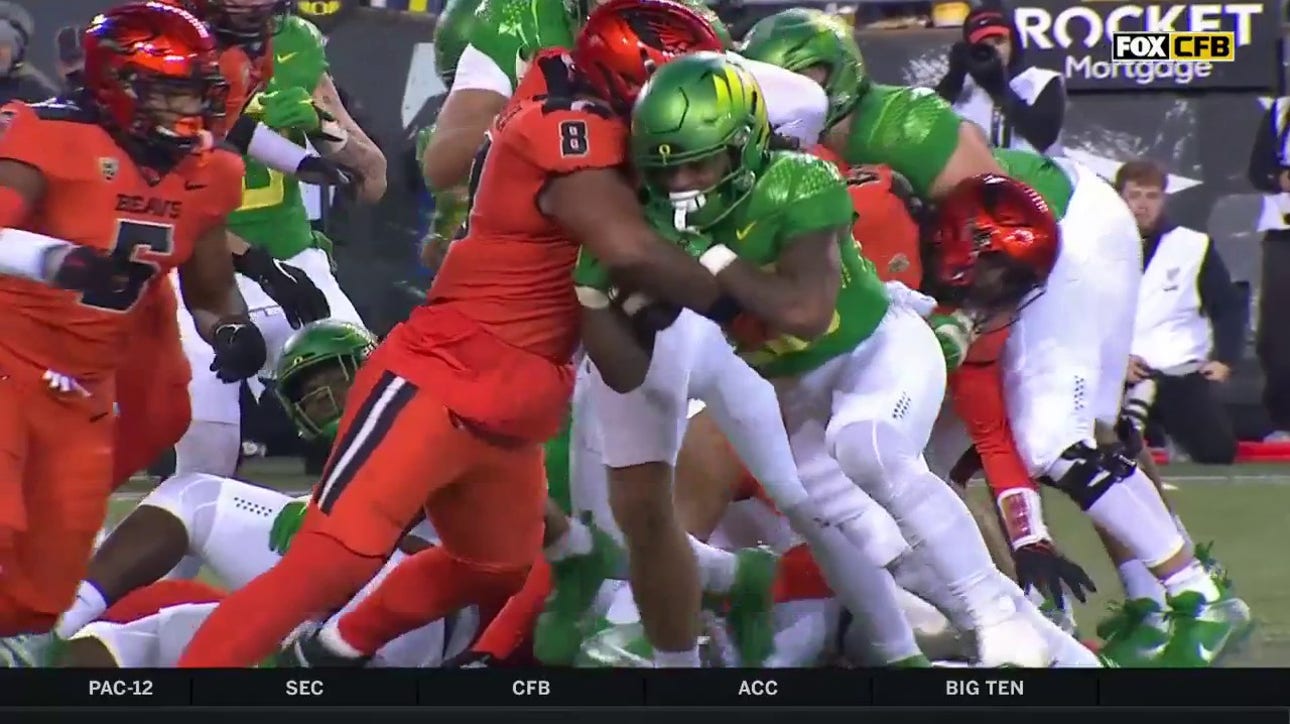 Jordan James punches in a one-yard touchdown to extend Oregon's lead over Oregon State