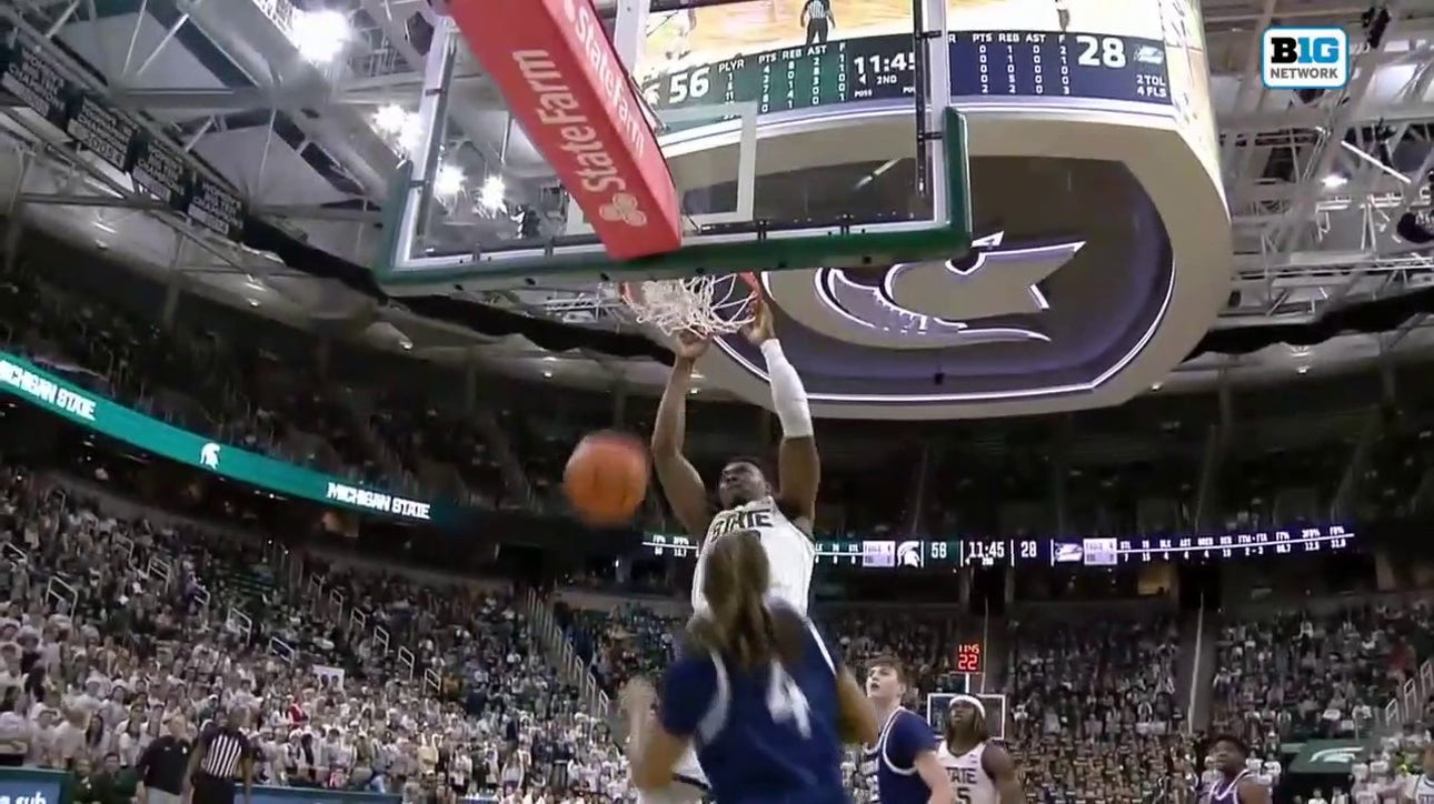 Michigan State's Mady Sissoko throws down a powerful two-handed dunk over a Georgia Southern defender
