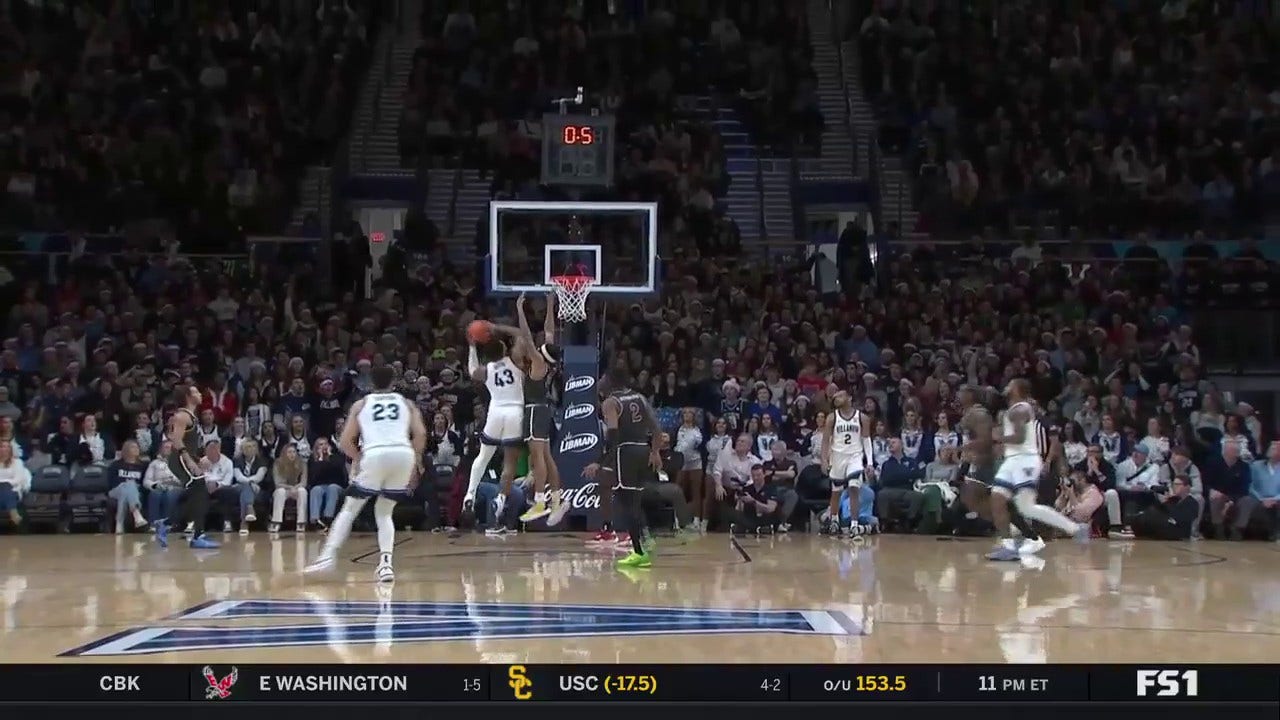 Villanova's Eric Dixon lays it in to beat the buzzer, trimming Saint Joseph's lead