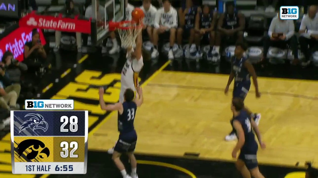 Brock Harding finds Owen Freeman under the basket for a strong two-handed slam to extend Iowa's lead over North Florida