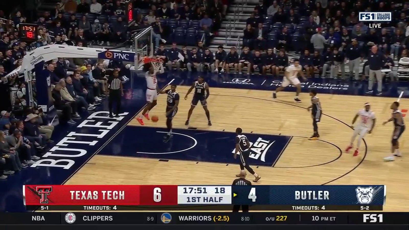Texas Tech's Warren Washington throws down the two-handed alley-oop against Butler