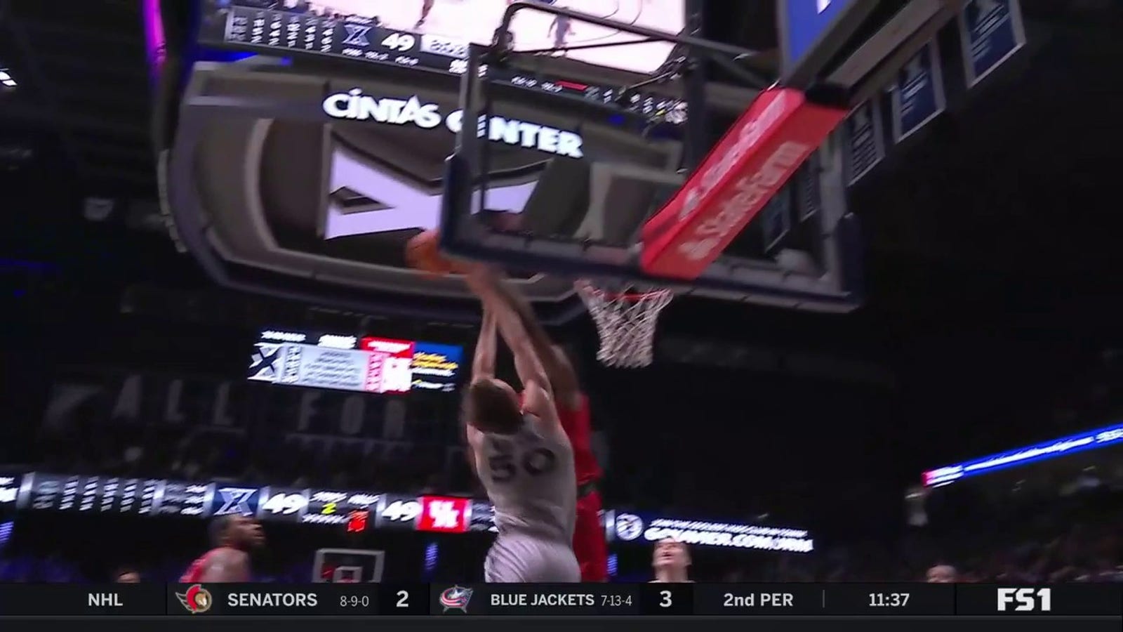 Houston's Joseph Tugler skies for the rejection to prevent Xavier from taking the lead