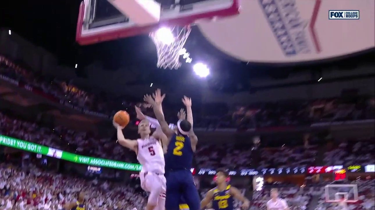 Tyler Wahl drives inside for the tough bucket plus the foul, extending Wisconsin's lead over Marquette