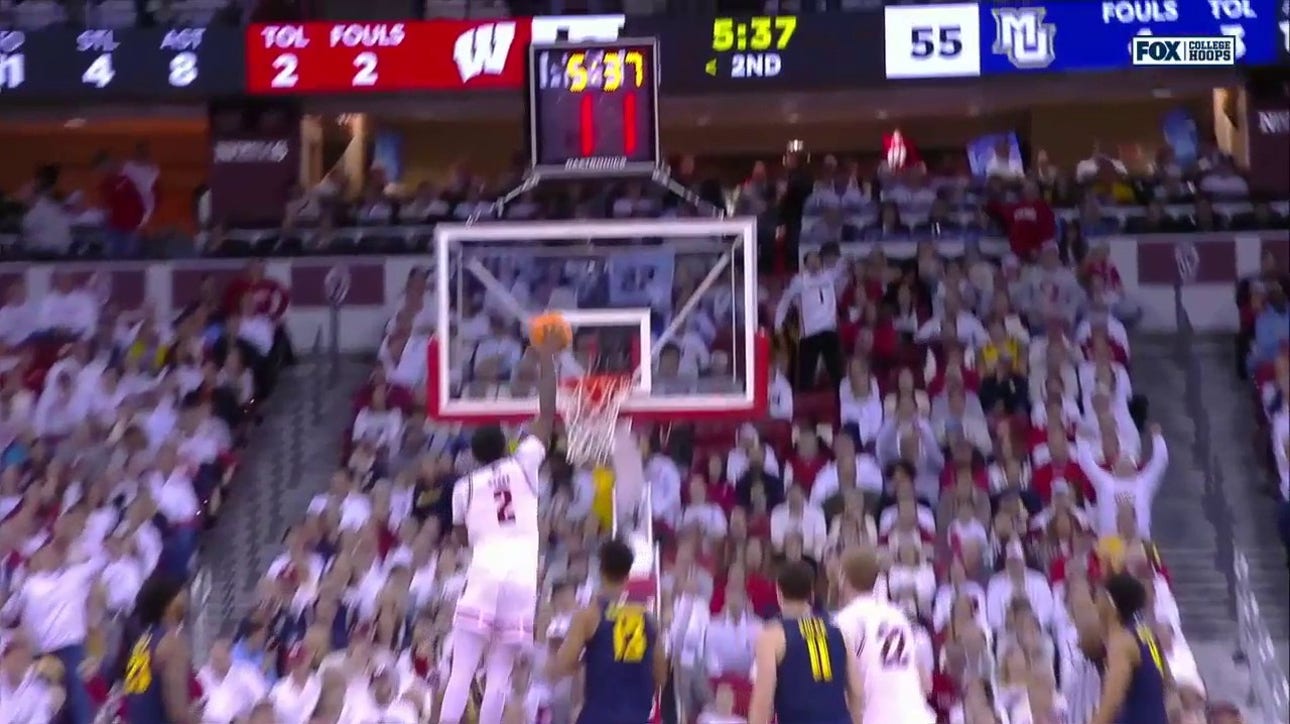 AJ Storr throws down a vicious one-handed jam, extending Wisconsin's lead over Marquette